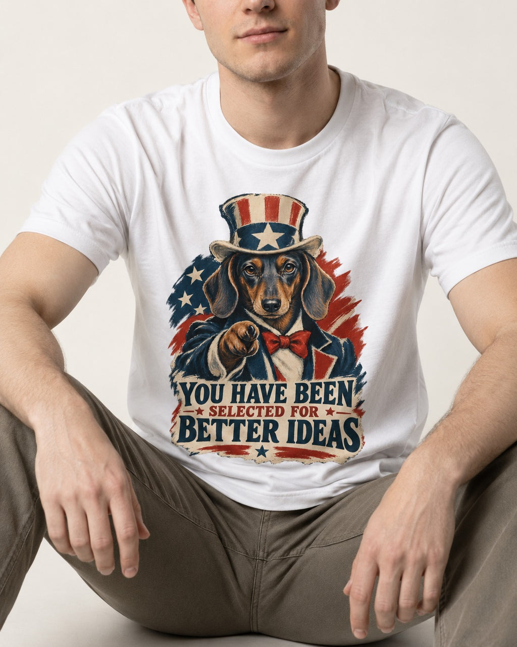 Dachshund Better Ideas T-Shirt in White, worn by a seated model