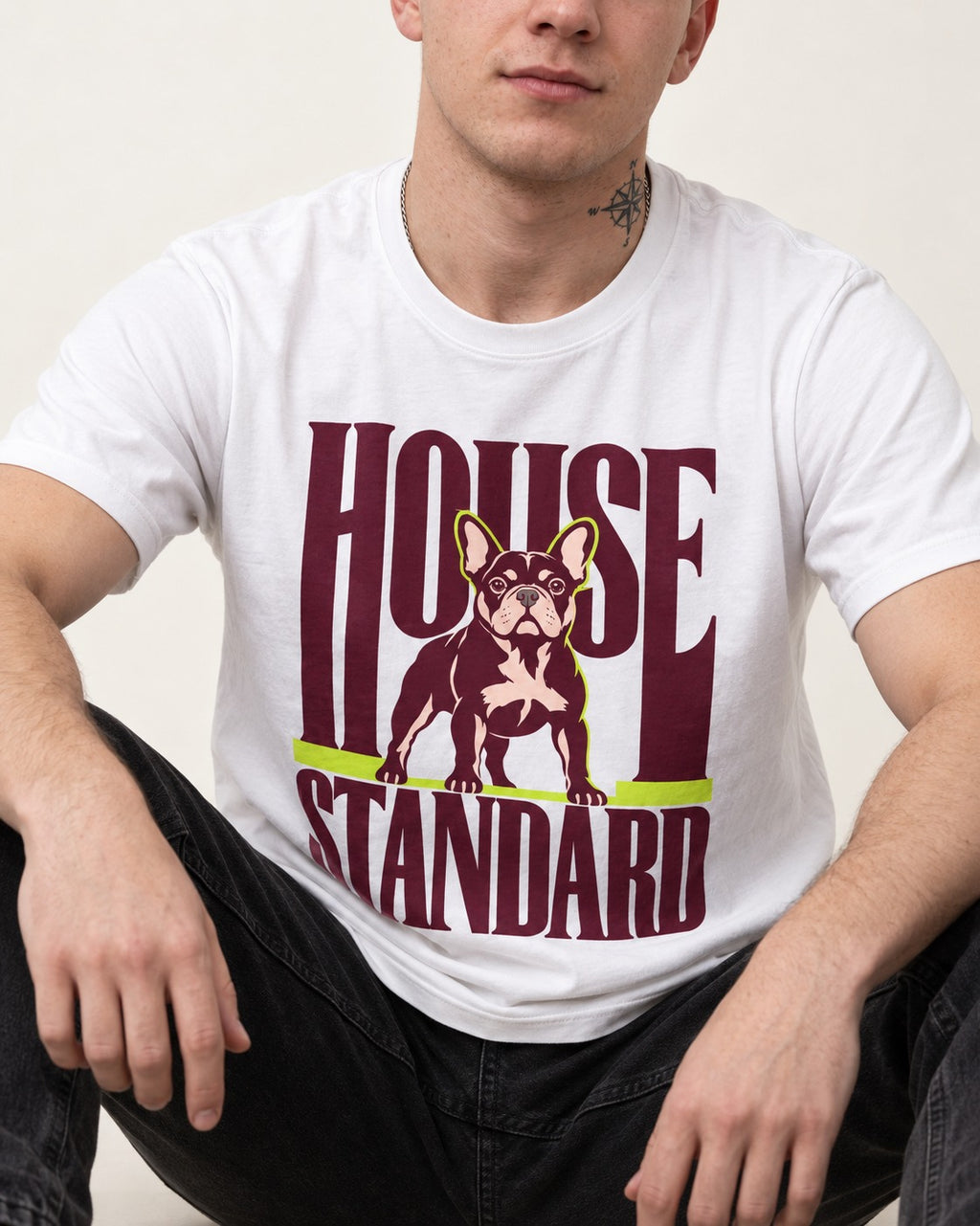 Frenchie House Standard T-Shirt in White, worn by a seated model