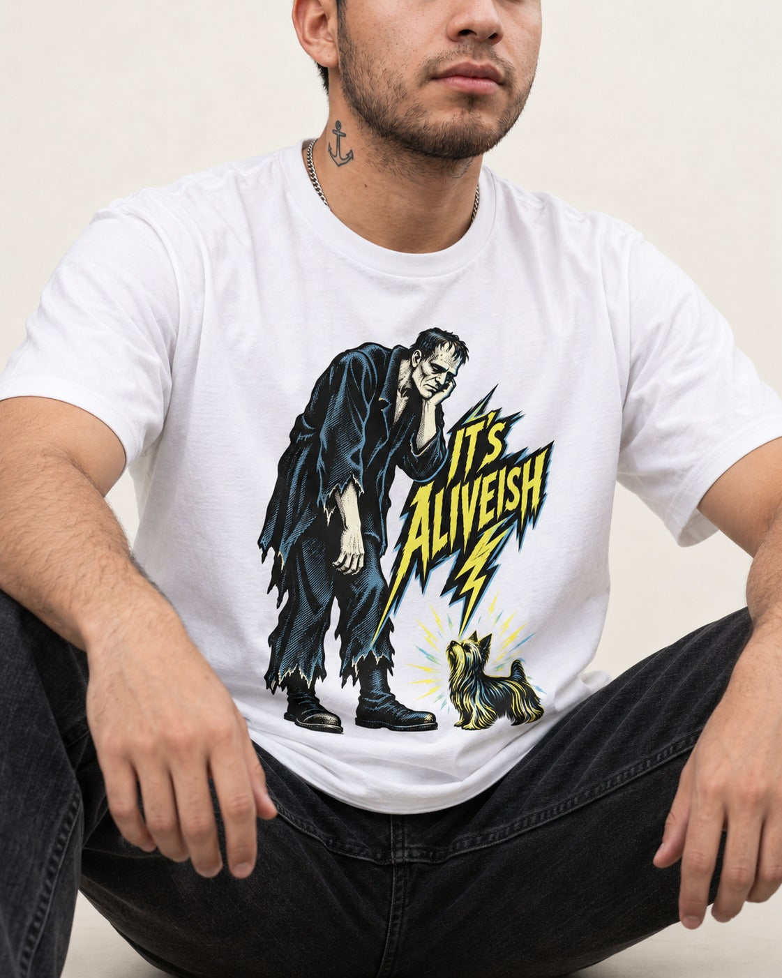 It's Aliveish Yorkshire Terrier T-Shirt in White, worn by a seated model