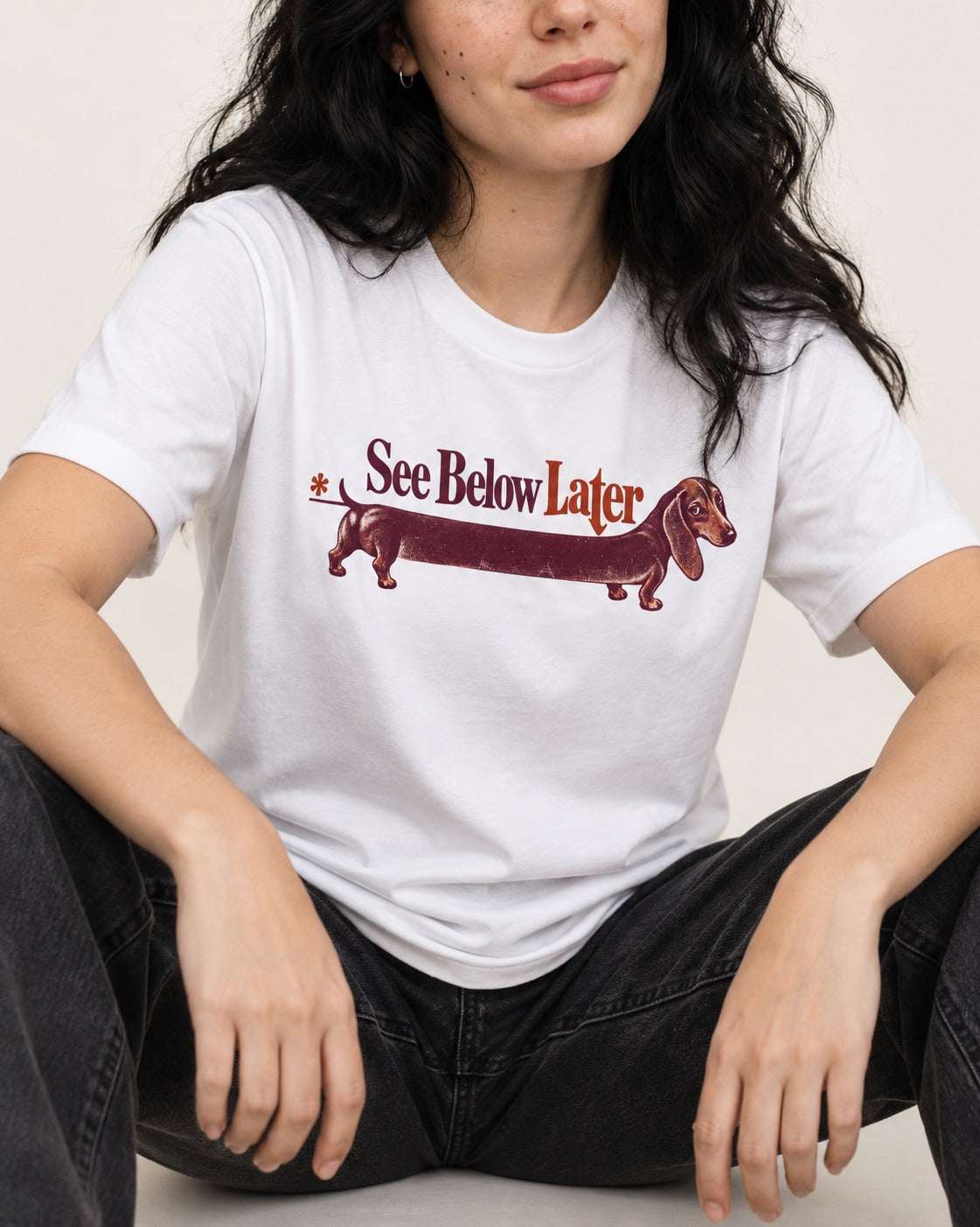 See Below Later Dachshund T-Shirt in White, worn by a seated model