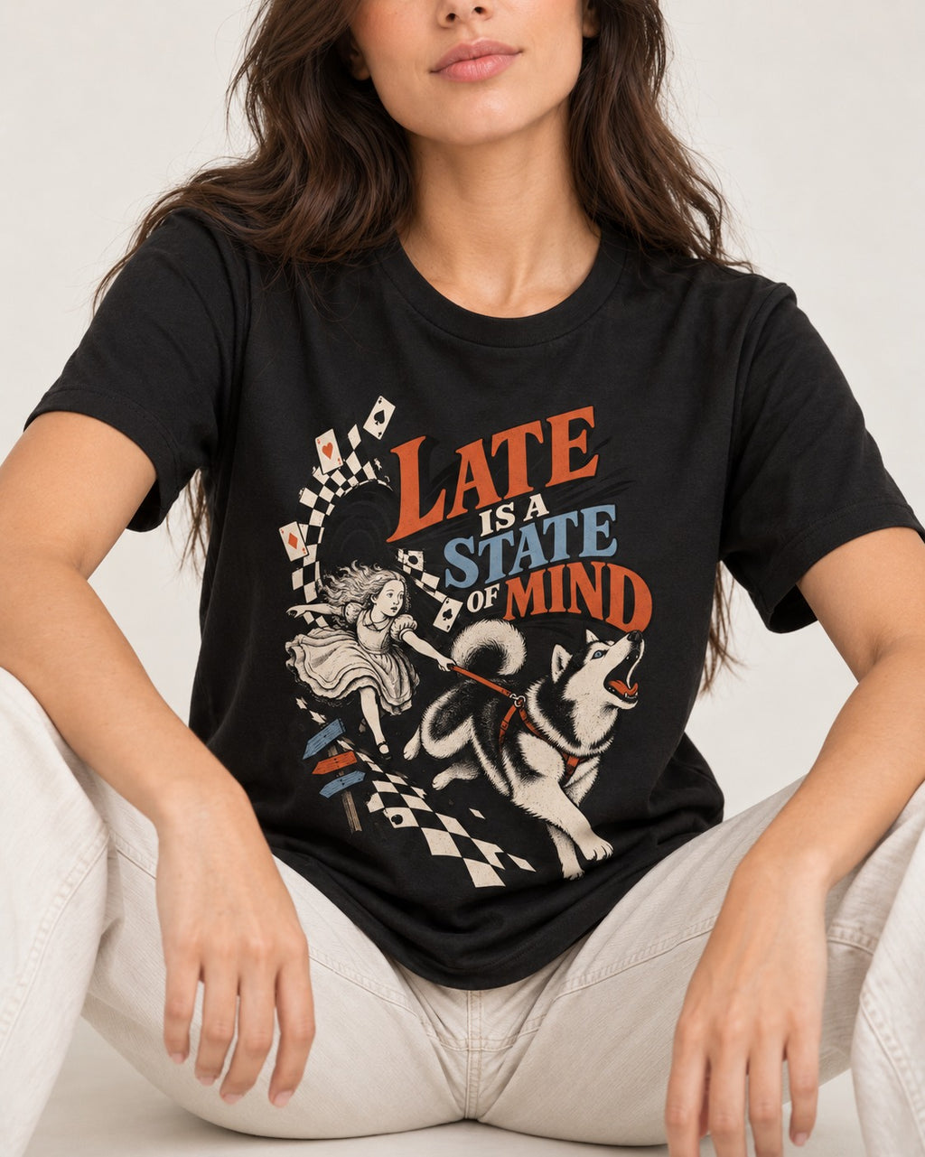 Husky Late Is a State of Mind Wonderland Chase Graphic T-Shirt in Black, worn by a seated model