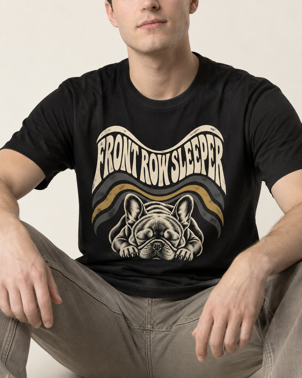 Frenchie Front Row Sleeper Retro Graphic T-Shirt in Black, worn by a seated model
