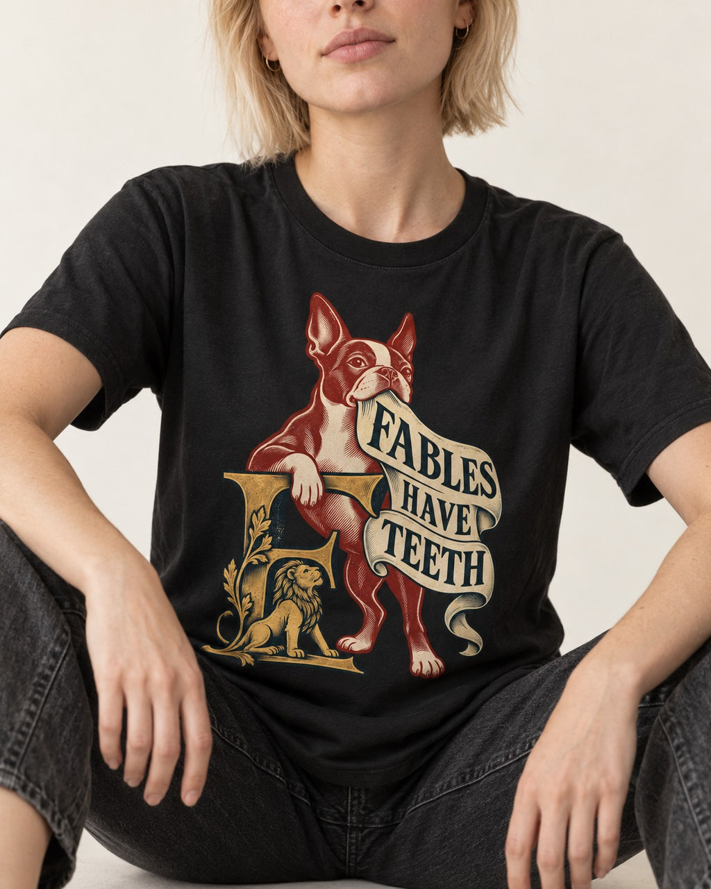 Boston Terrier Fables Have Teeth T-Shirt in Black, worn by a seated model