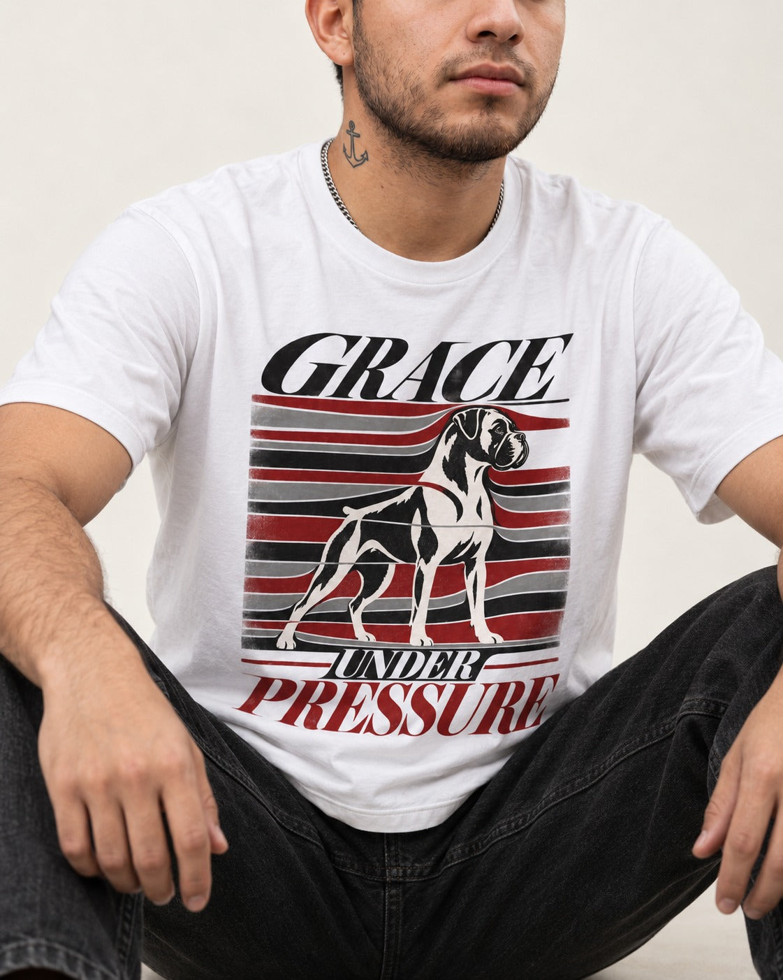 Boxer Grace Under Pressure T-Shirt in White, worn by a seated model