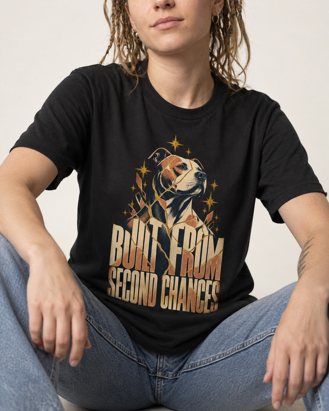 Pitbull Built from Second Chances Kintsugi Graphic T-Shirt in Black, worn by a seated model