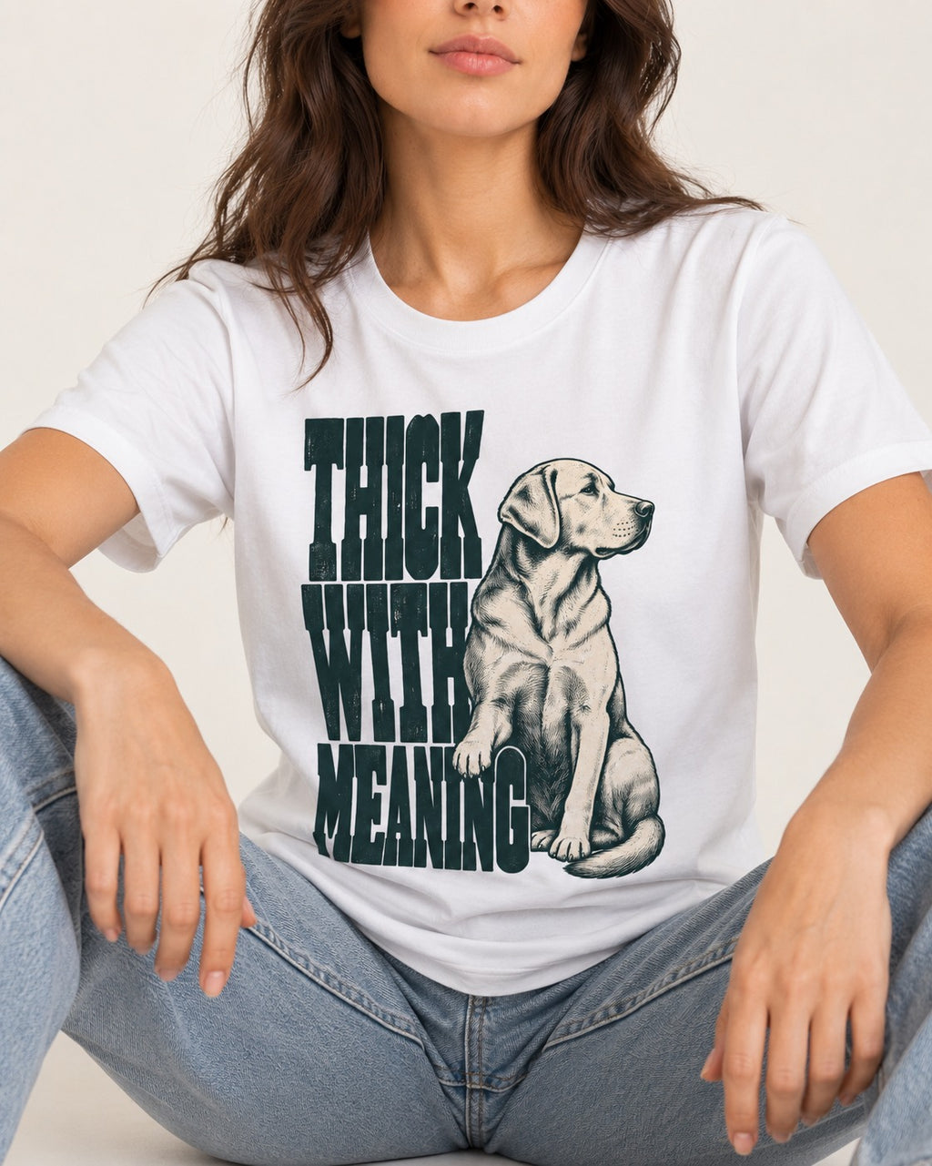 Thick with Meaning Labrador Retriever T-Shirt in White, worn by a seated model