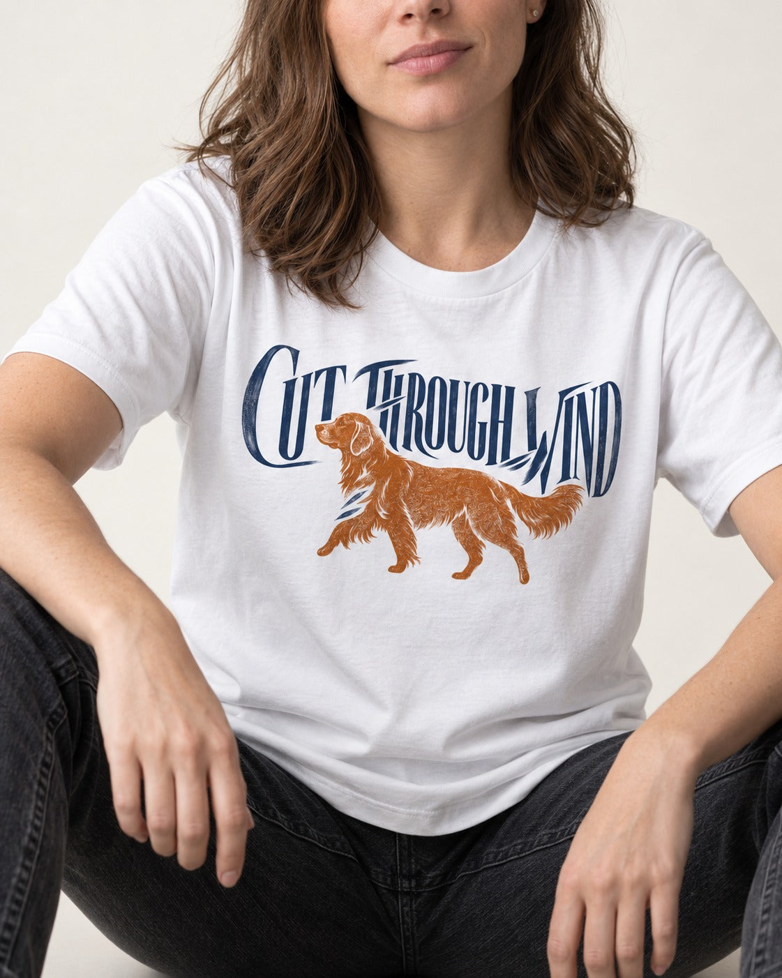 Golden Retriever Cut Through Land T-Shirt in White, worn by a seated model