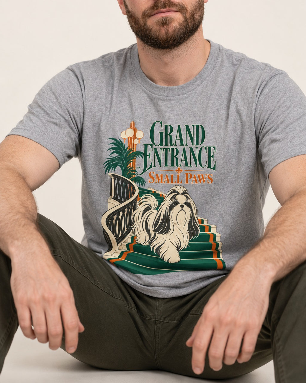 Shih Tzu Grand Entrance Small Paws Staircase Graphic T-Shirt in Sport Grey, worn by a seated model