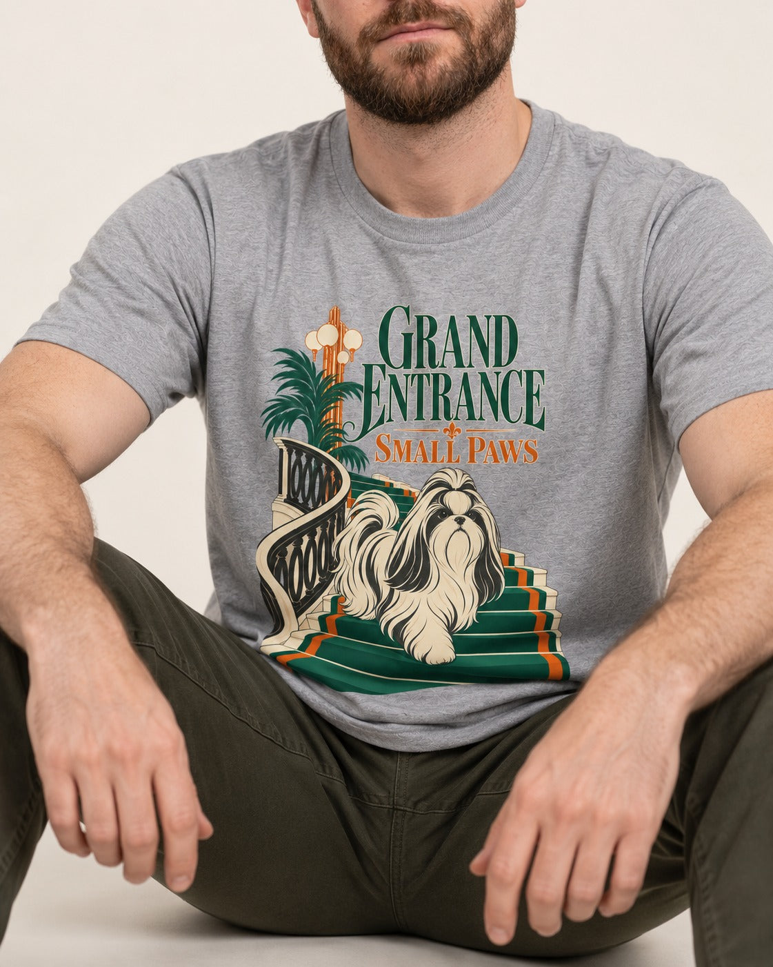Shih Tzu Grand Entrance Small Paws Staircase Graphic T-Shirt in Sport Grey, worn by a seated model