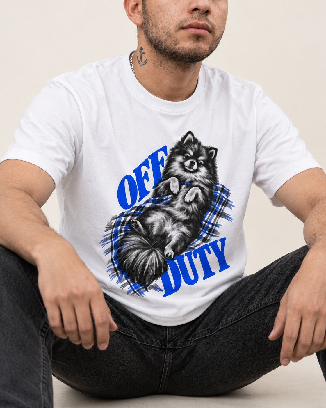 Off Duty Pomeranian T-Shirt in White, worn by a seated model