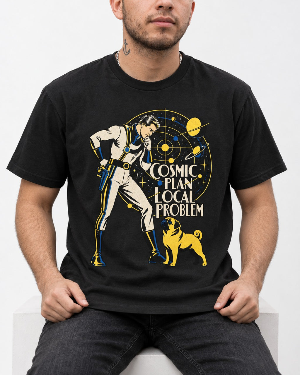 Pug Cosmic Plan Local Problem Astronaut Graphic T-Shirt in Black, worn by a seated model