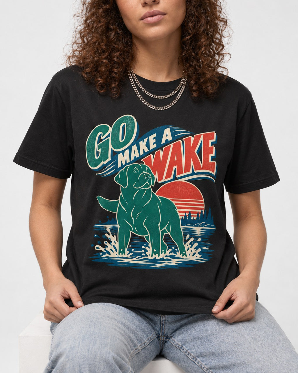 Labrador Retriever Go Make a Wake Lake Graphic T-Shirt in Black, worn by a seated model
