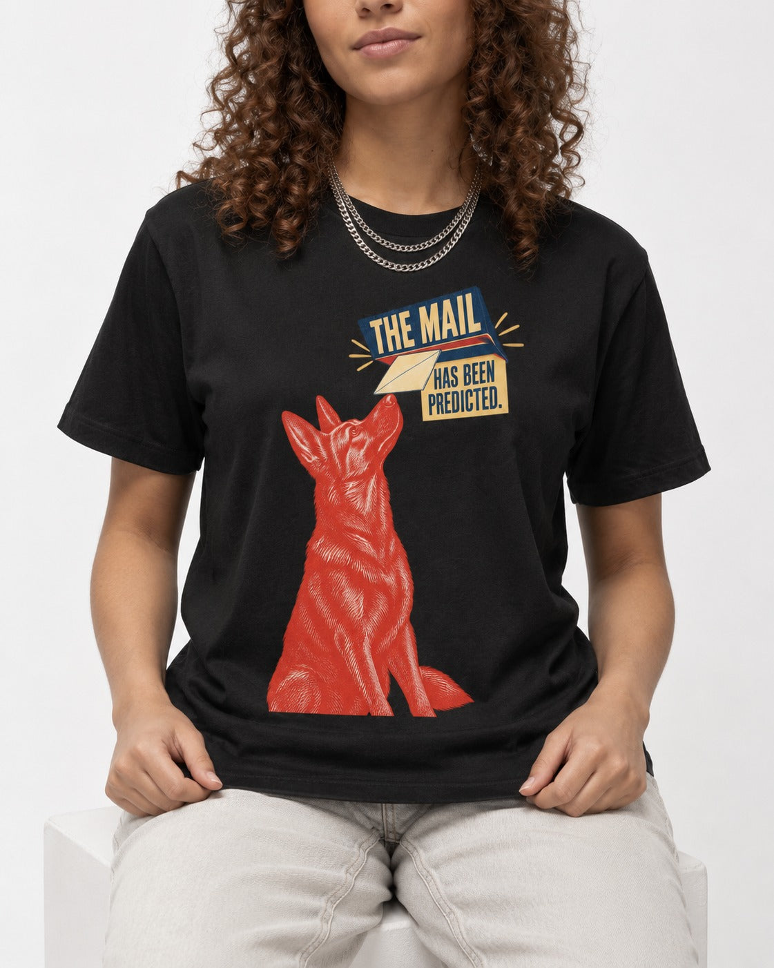 German Shepherd Dog Mail Predicted Graphic T-Shirt in Black, worn by a seated model