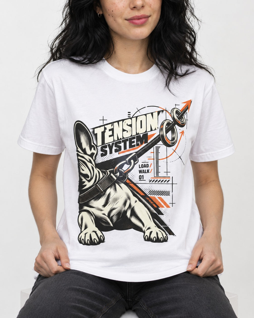 Frenchie Tension System T-Shirt in White, worn by a seated model