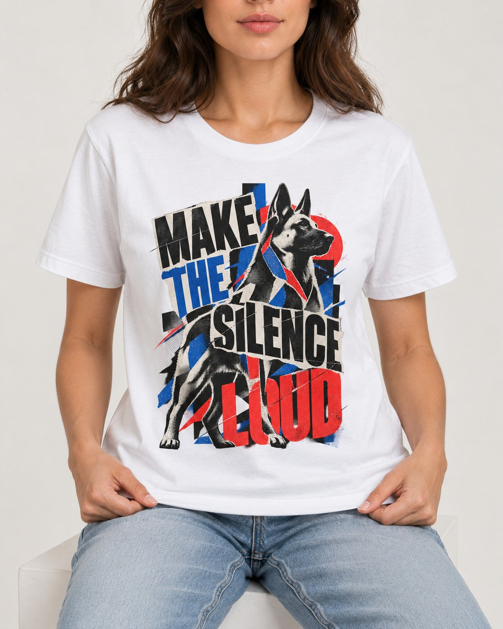 German Shepherd Dog Make the Silence Loud T-Shirt in White, worn by a seated model