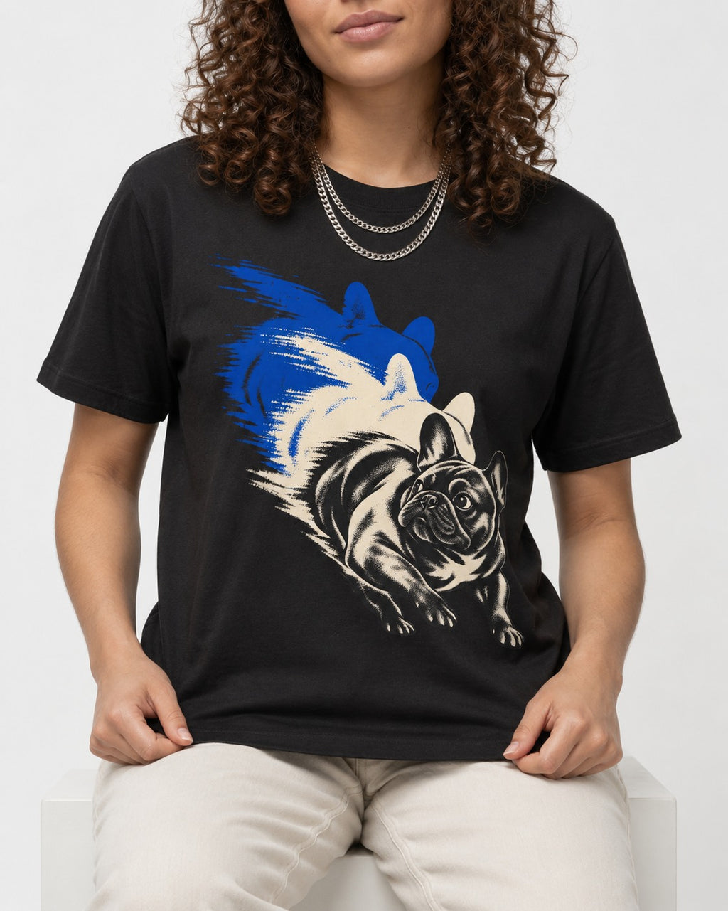 Frenchie Blue Brush Zoomie Graphic T-Shirt in Black, worn by a seated model