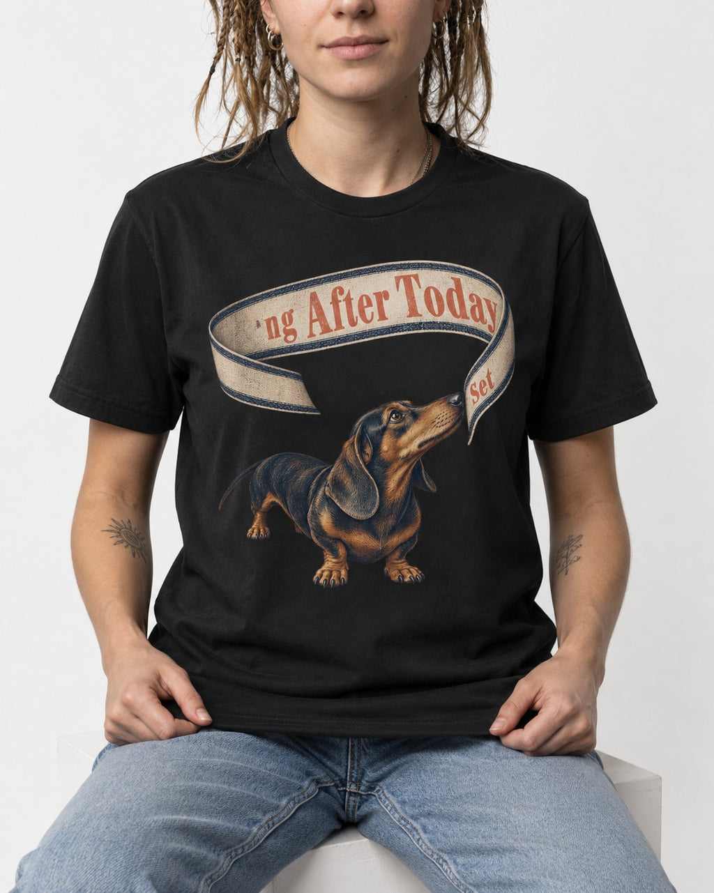 Dachshund ng After Today Set Ribbon Graphic T-Shirt in Black, worn by a seated model