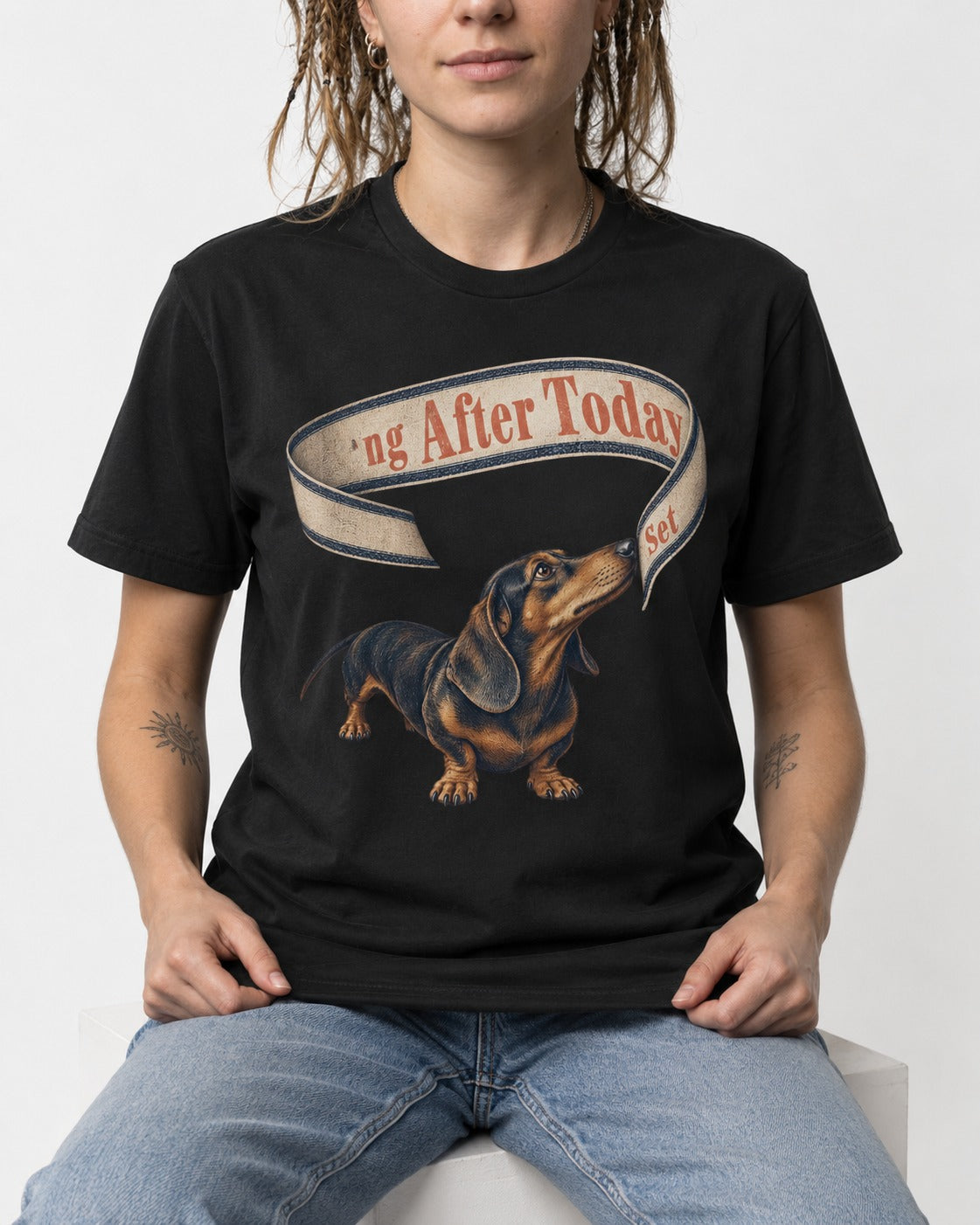 Dachshund ng After Today Set Ribbon Graphic T-Shirt in Black, worn by a seated model