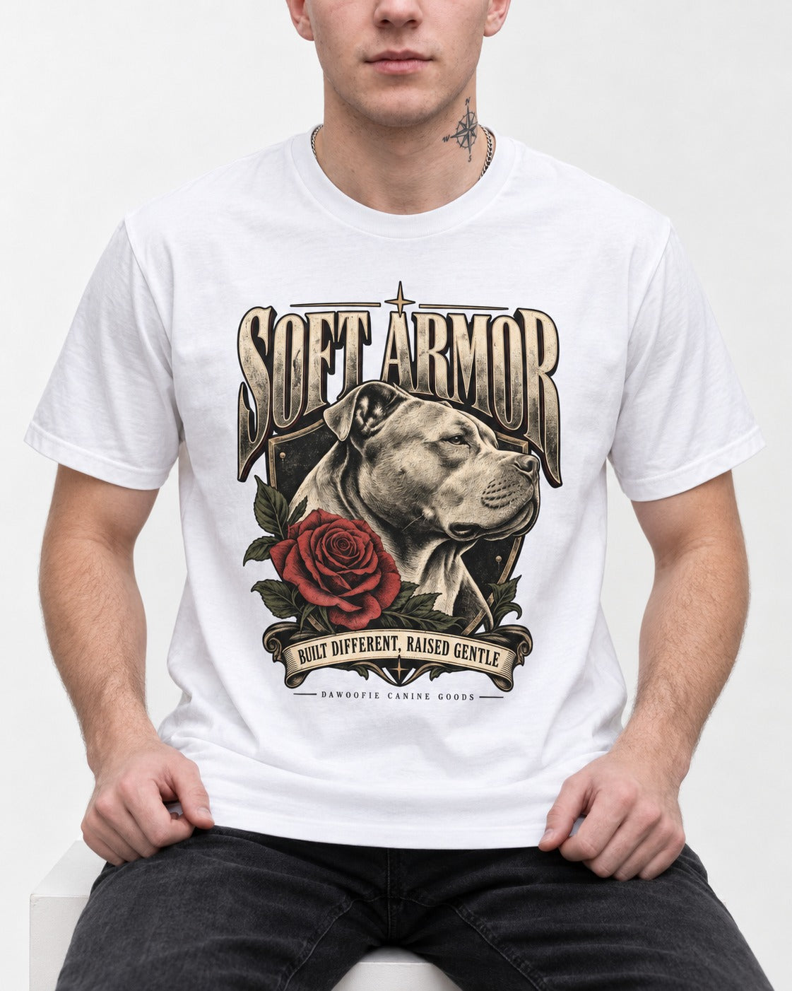 Pitbull Soft Armor T-Shirt in White, worn by a seated model