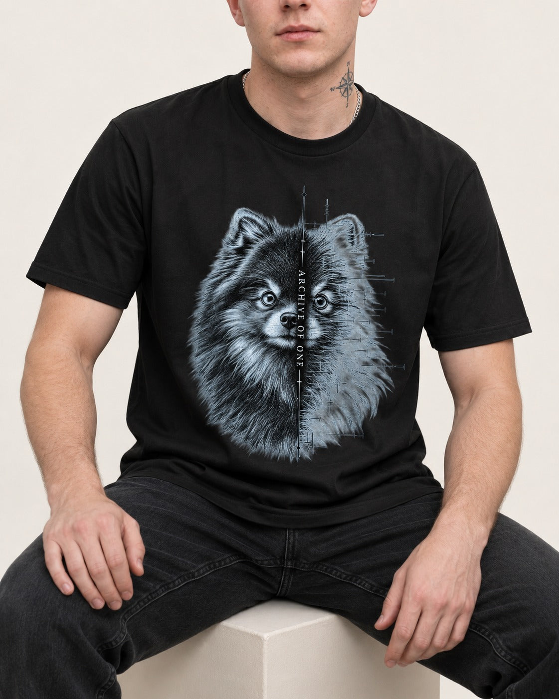 Pomeranian Archive of One Split Portrait Graphic T-Shirt in Black, worn by a seated model