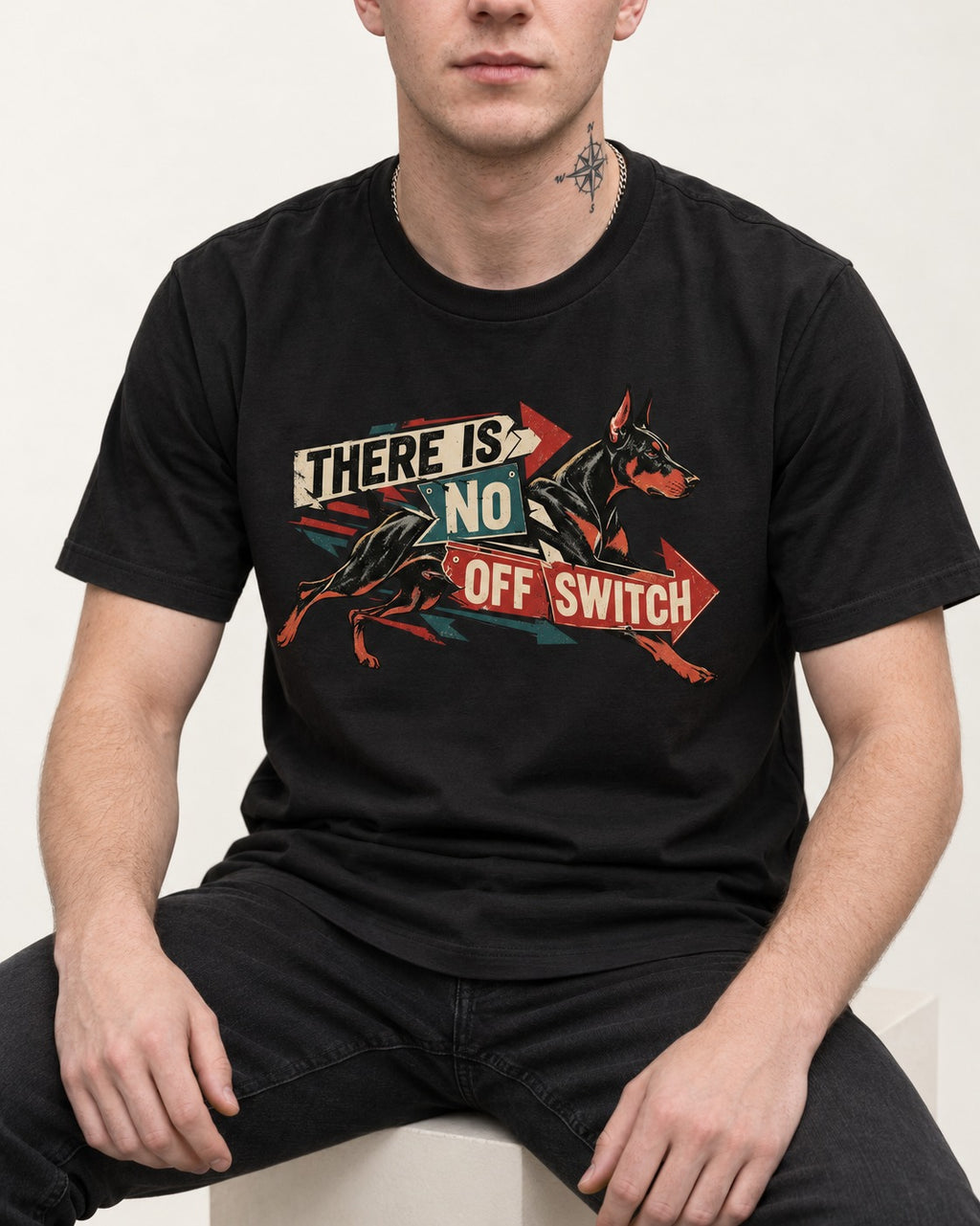 Doberman There Is No Off Switch Arrow Sprint Graphic T-Shirt in Black, worn by a seated model