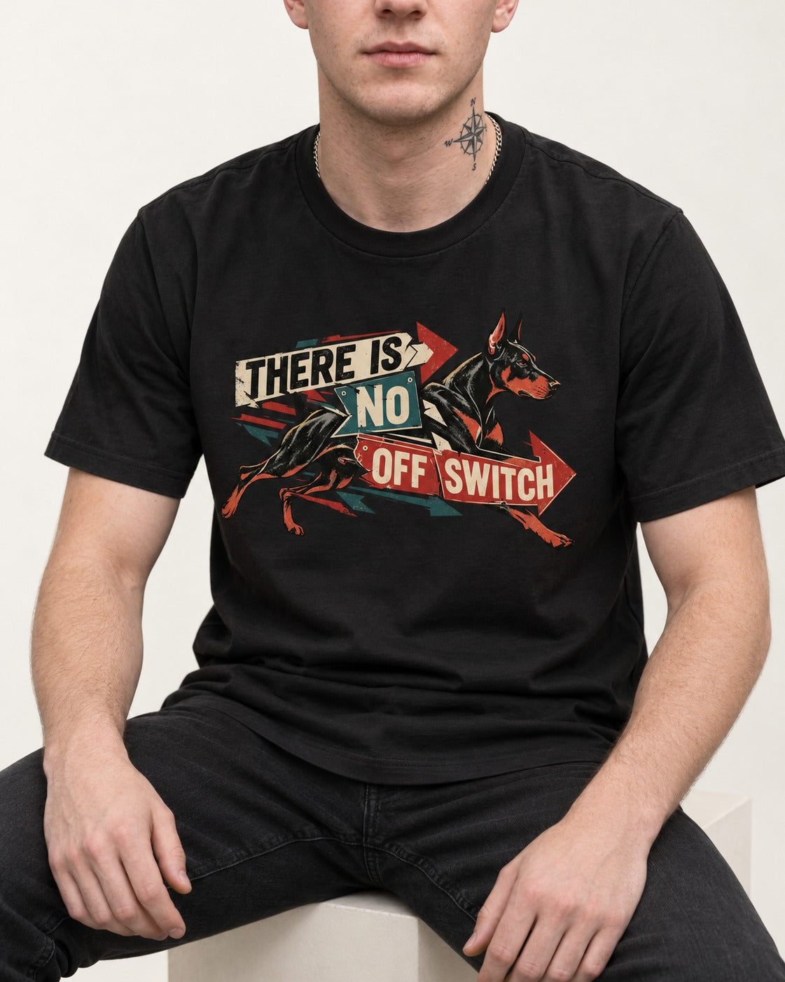 Doberman There Is No Off Switch Arrow Sprint Graphic T-Shirt in Black, worn by a seated model