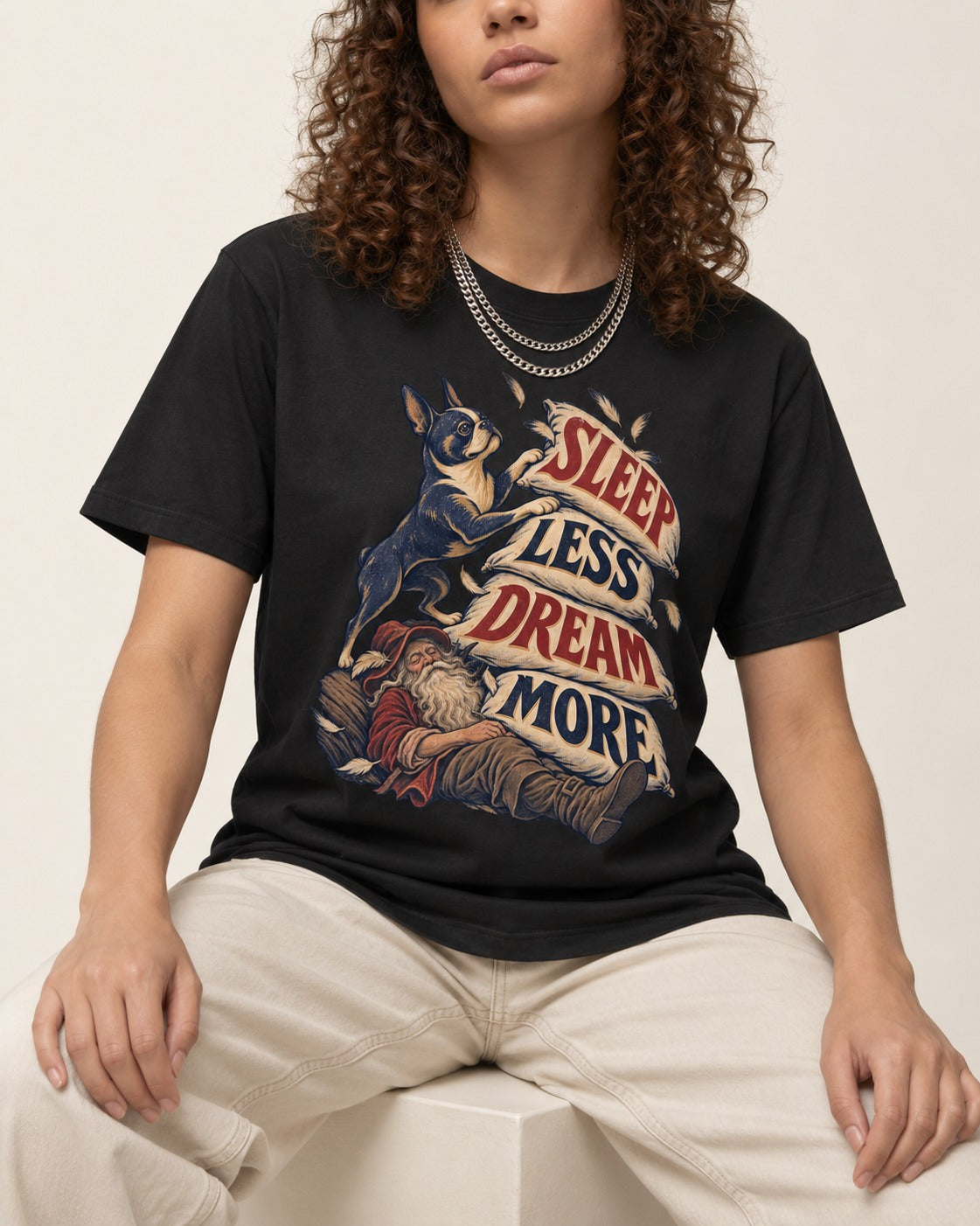 Boston Terrier Sleep Less Dream More T-Shirt in Black, worn by a seated model
