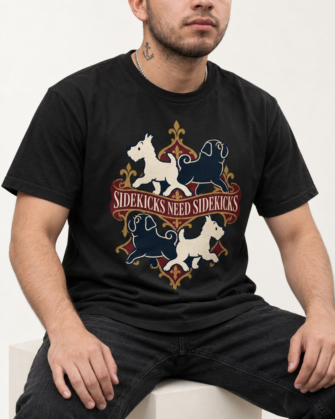 Pug Sidekicks Need Sidekicks Heraldic Graphic T-Shirt in Black, worn by a seated model