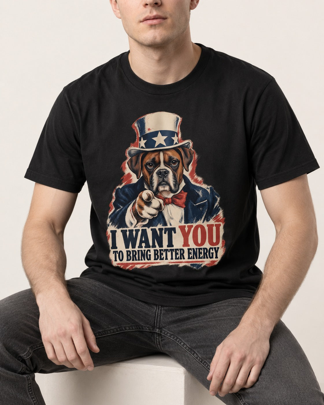 I Want You to Bring Better Energy Boxer Recruitment Poster Graphic T-Shirt in Black, worn by a seated model