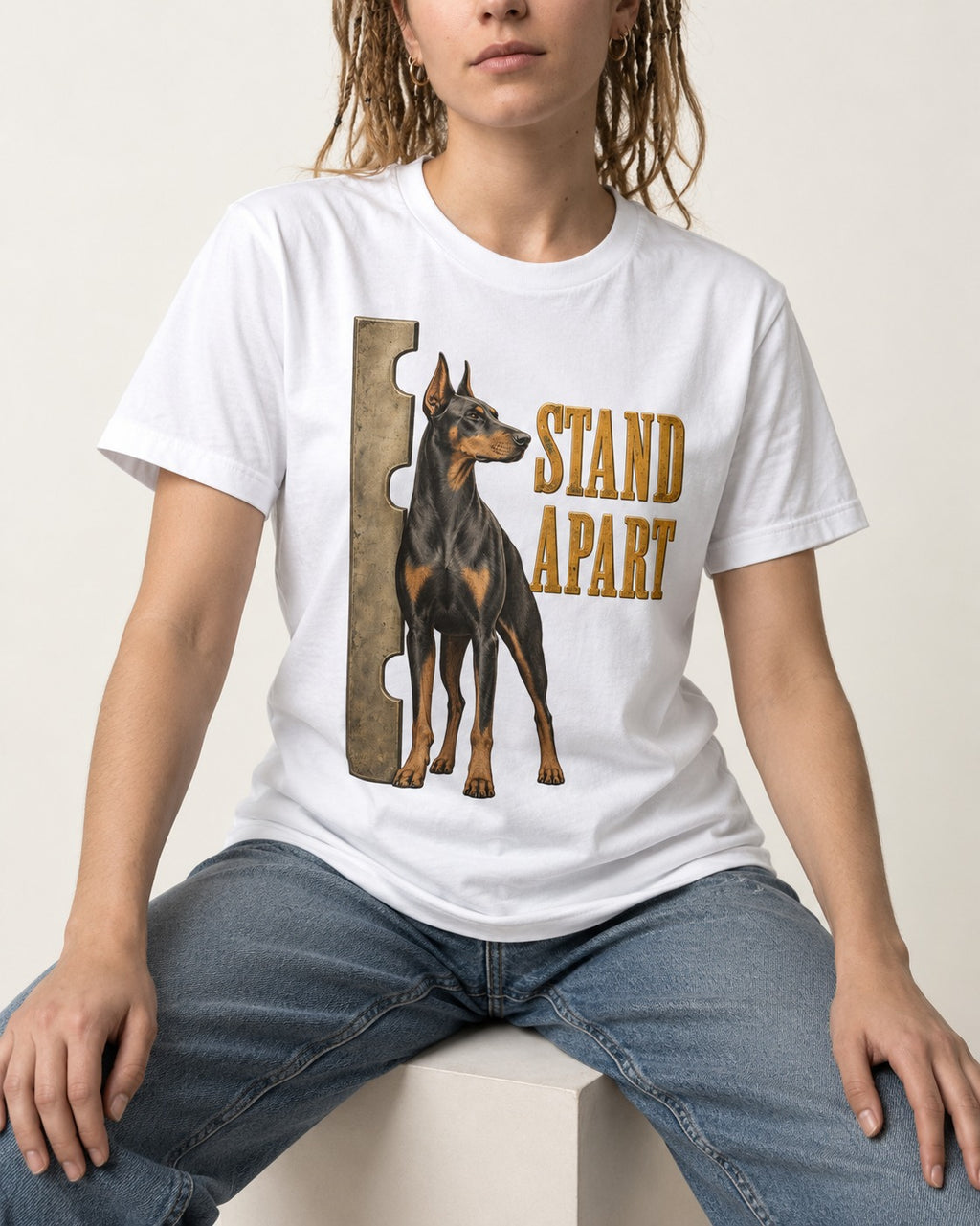 Doberman Stand Apart T-Shirt in White, worn by a seated model