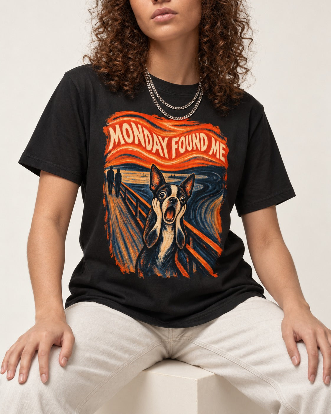 Monday Found Me Boston Terrier Scream Graphic T-Shirt in Black, worn by a seated model