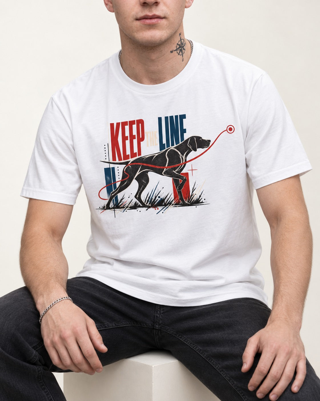 Keep the Line German Shorthaired Pointer T-Shirt in White, worn by a seated model