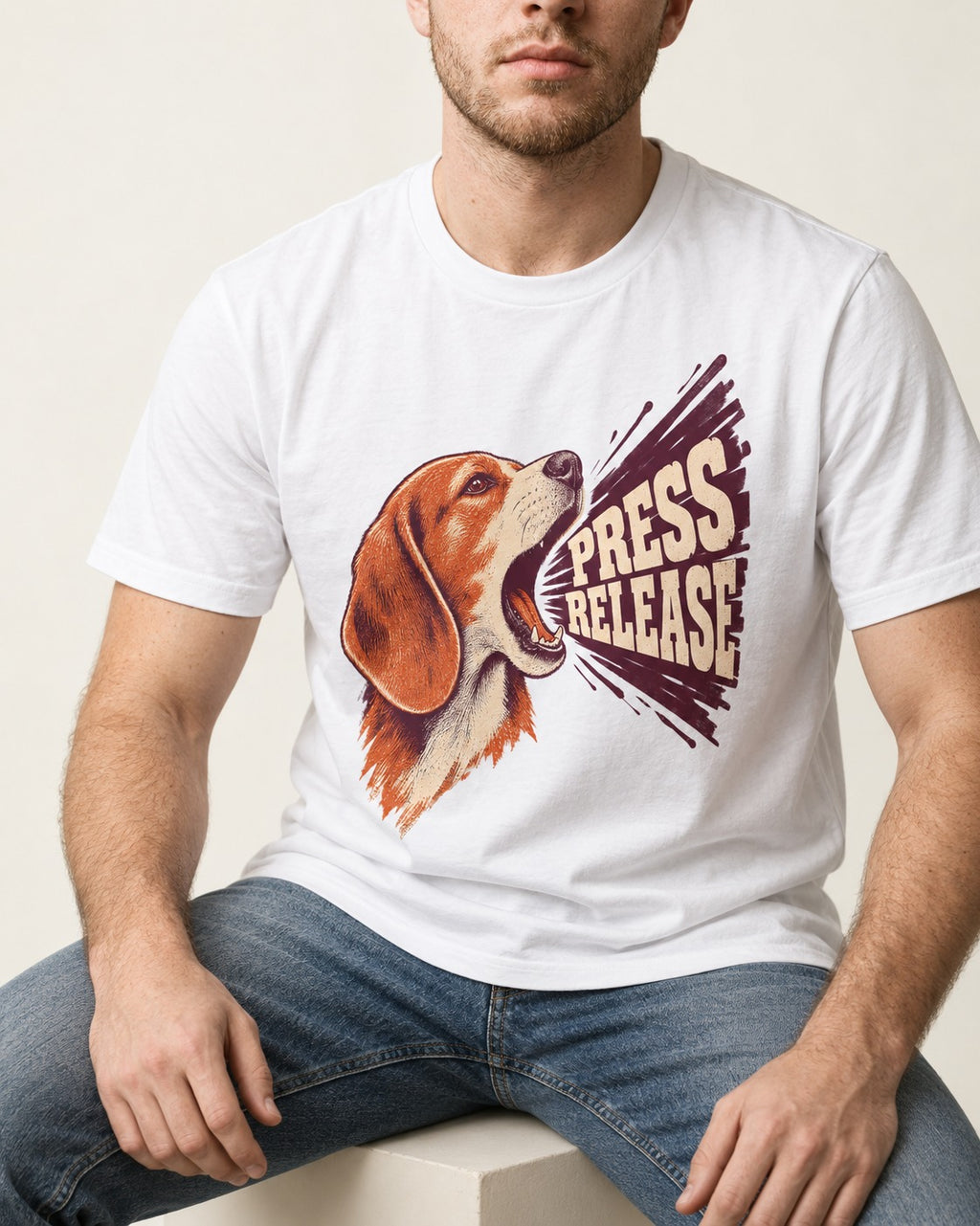 Beagle Press Release T-Shirt in White, worn by a seated model