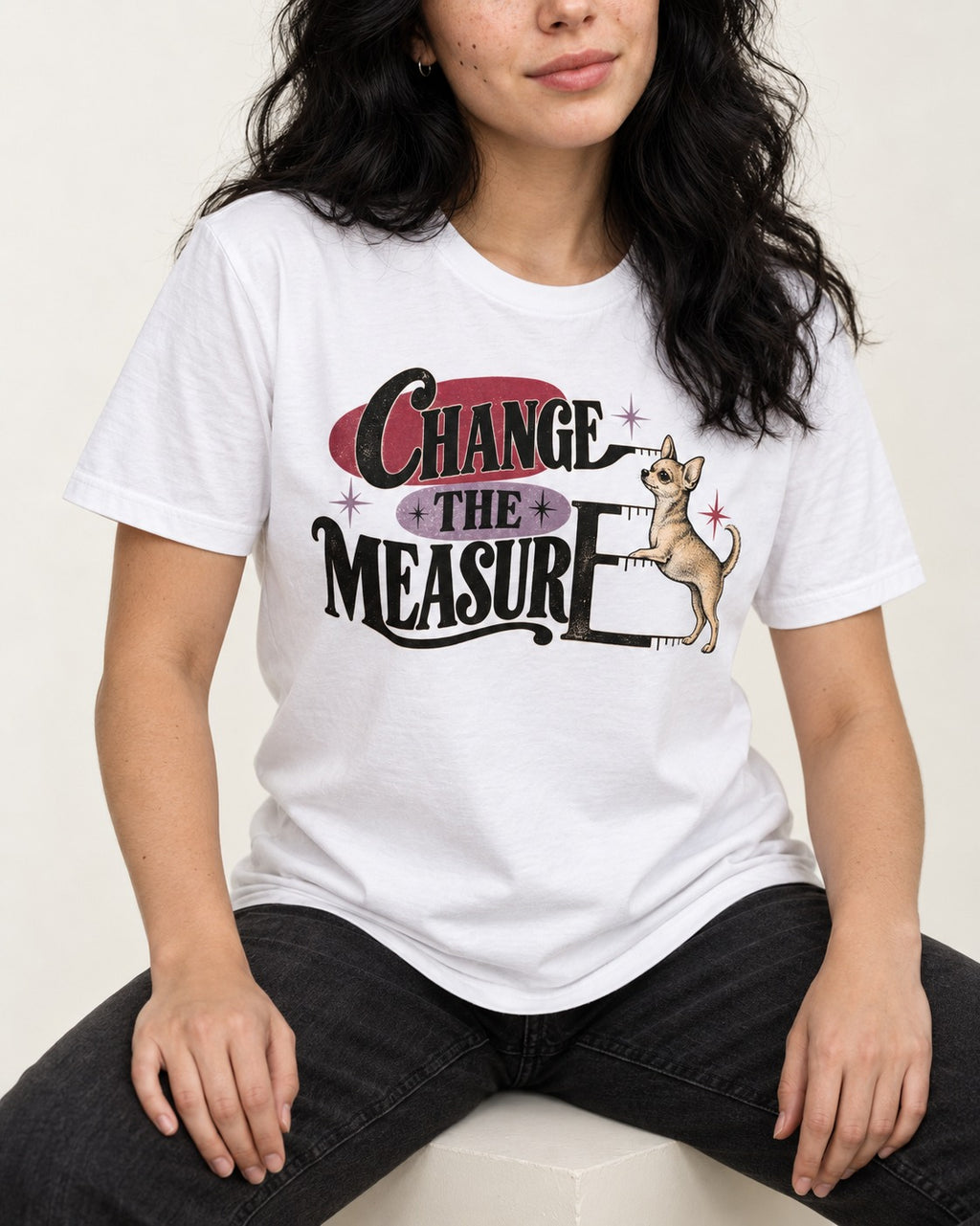 Change the Measure Chihuahua T-Shirt in White, worn by a seated model