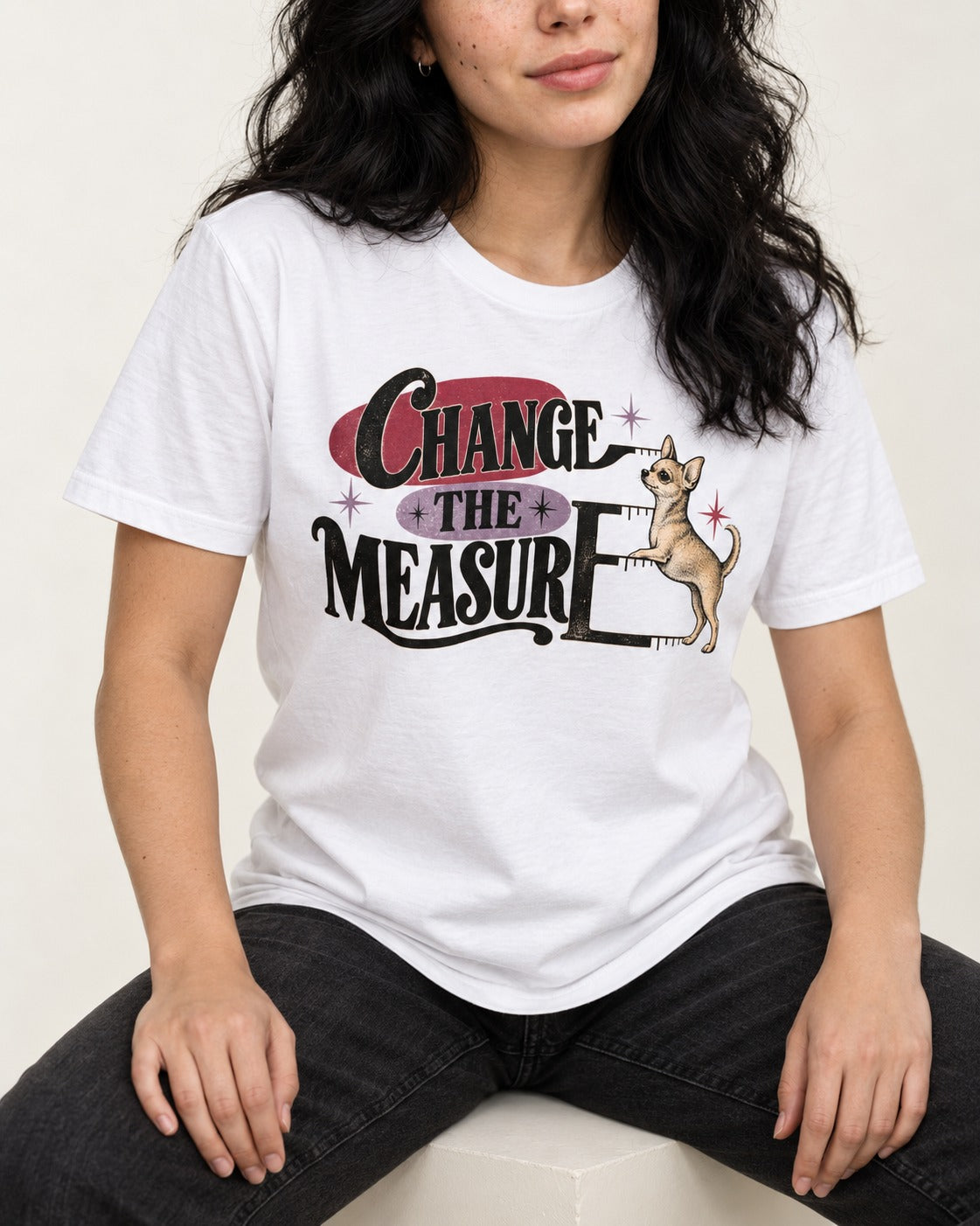Change the Measure Chihuahua T-Shirt in White, worn by a seated model