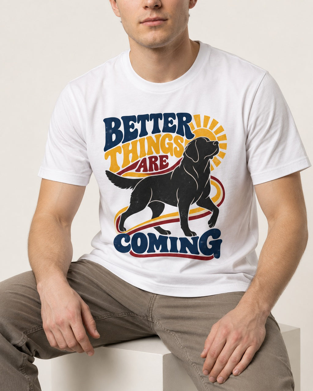Better Things Are Coming Labrador Retriever T-Shirt in White, worn by a seated model