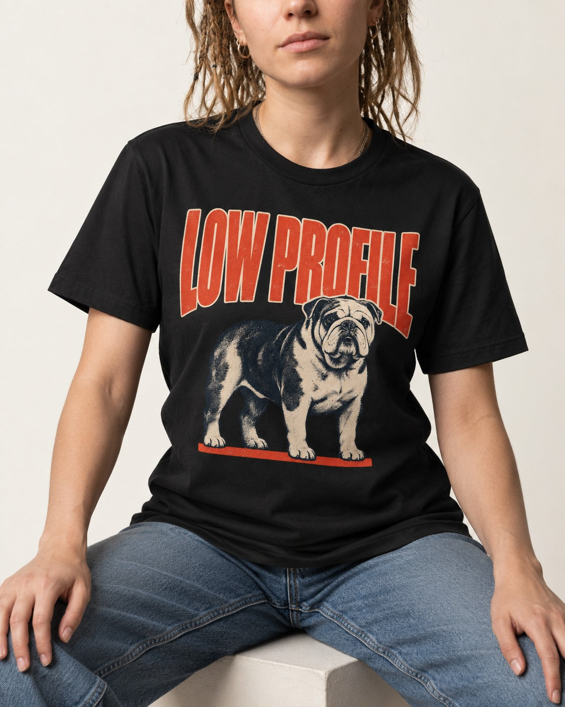 English Bulldog Low Profile Standing Graphic T-Shirt in Black, worn by a seated model