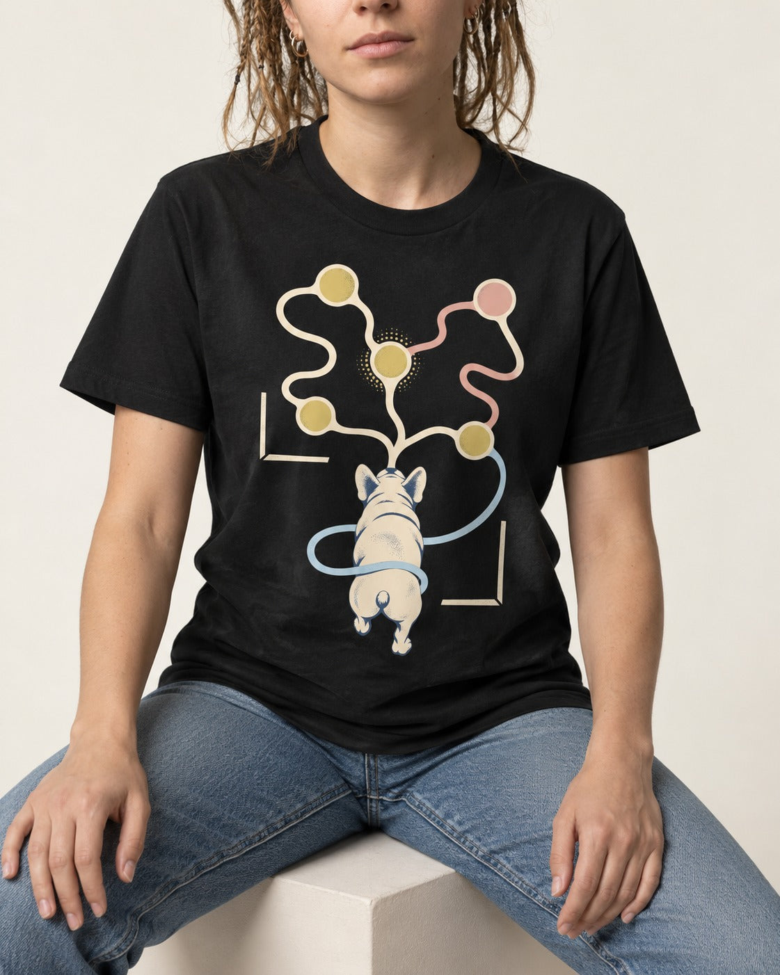 Frenchie Scent Circuit Rear View Graphic T-Shirt in Black, worn by a seated model