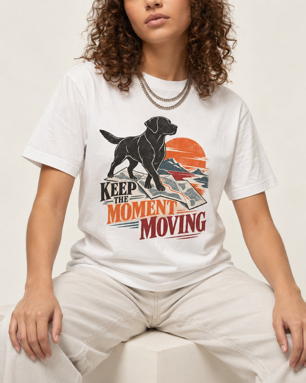 Keep the Moment Moving Labrador Retriever T-Shirt in White, worn by a seated model