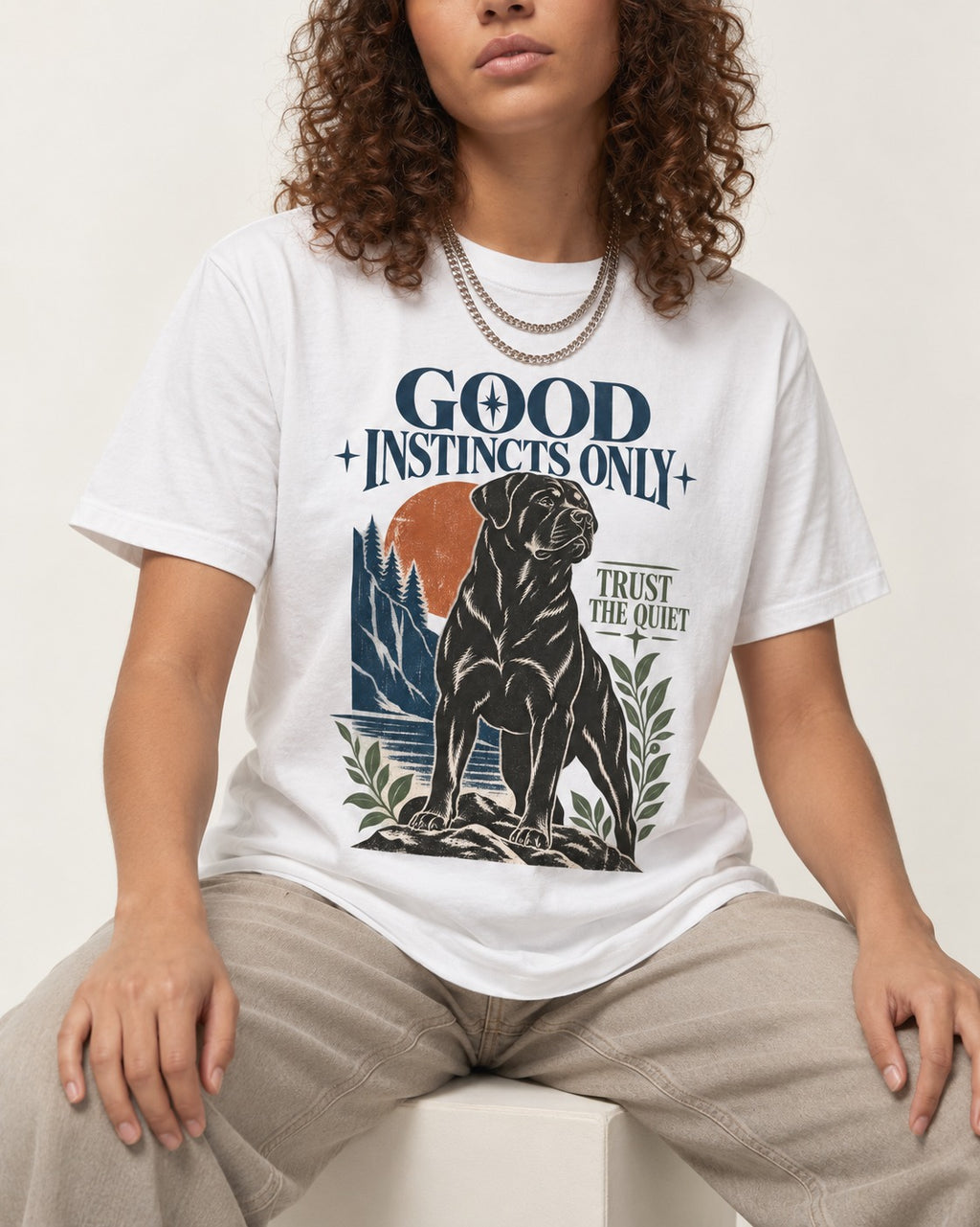 Good Instincts Only Rottweiler T-Shirt in White, worn by a seated model