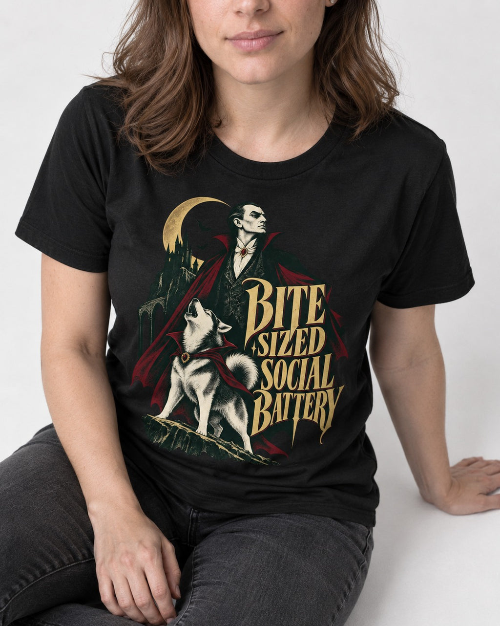 Husky Bite Sized Social Battery Vampire Graphic T-Shirt in Black, worn by a seated model