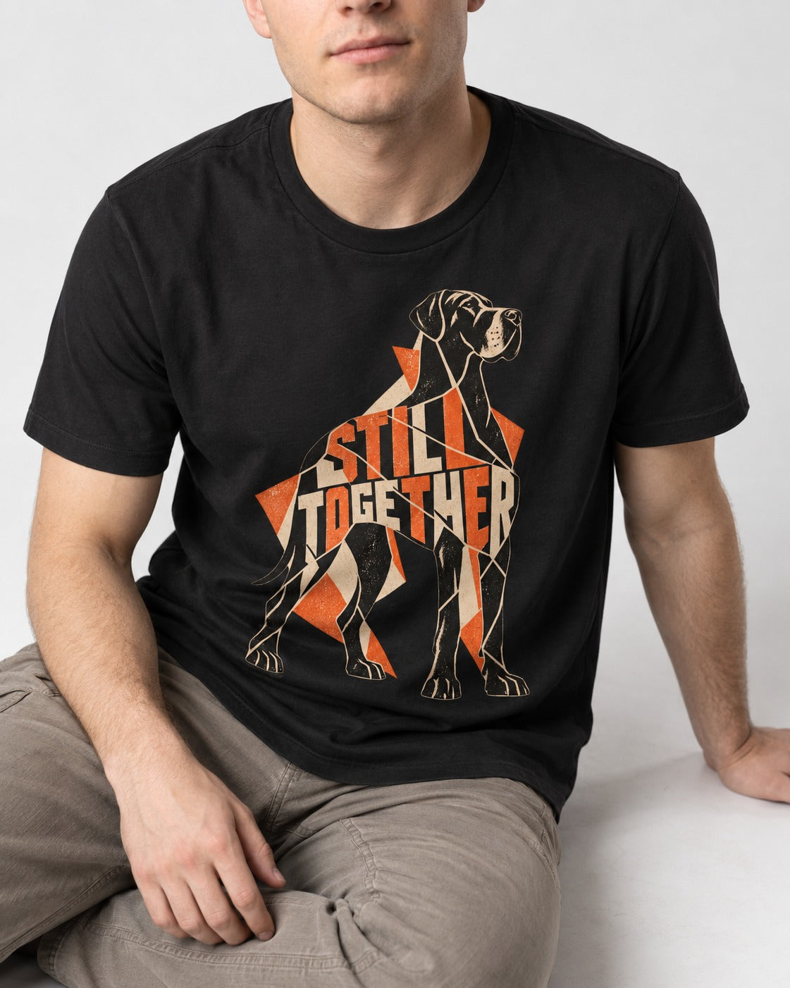Great Dane Still Together Geometric Mosaic Graphic T-Shirt in Black, worn by a seated model