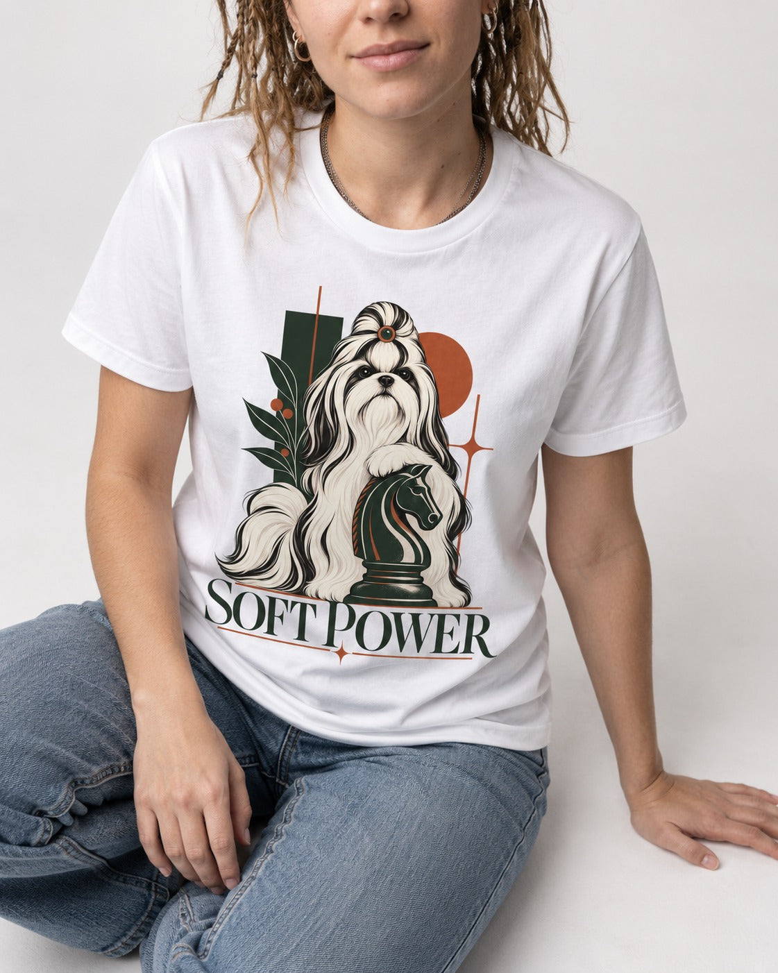 Soft Power Shih Tzu T-Shirt in White, worn by a seated model