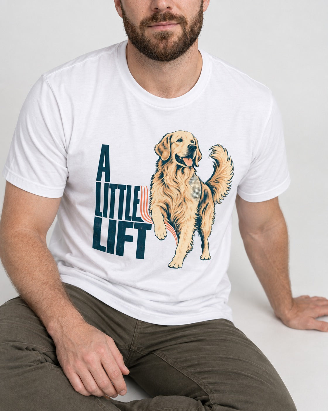 A Little Lift Golden Retriever T-Shirt in White, worn by a seated model