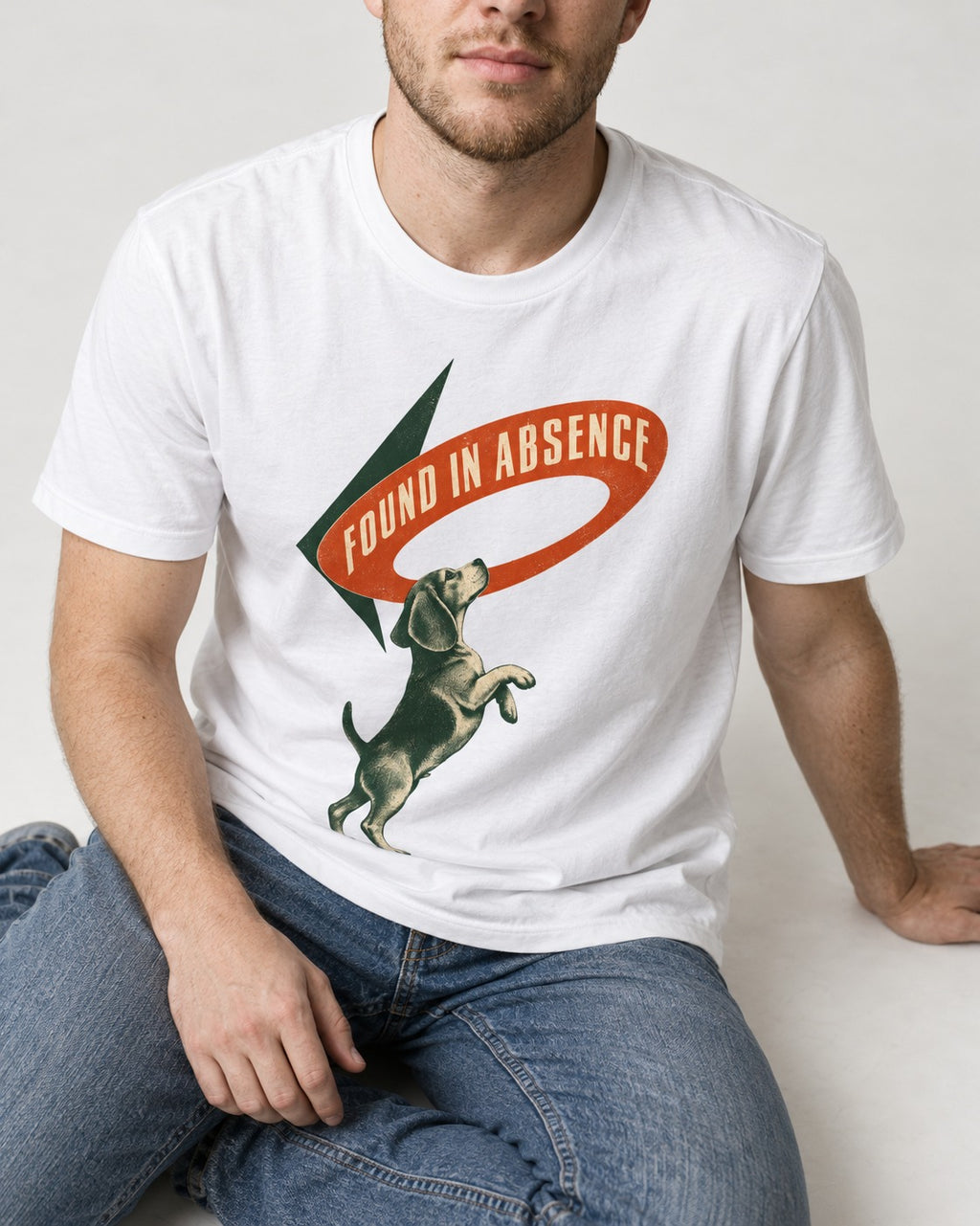 Beagle Found in Absence T-Shirt in White, worn by a seated model