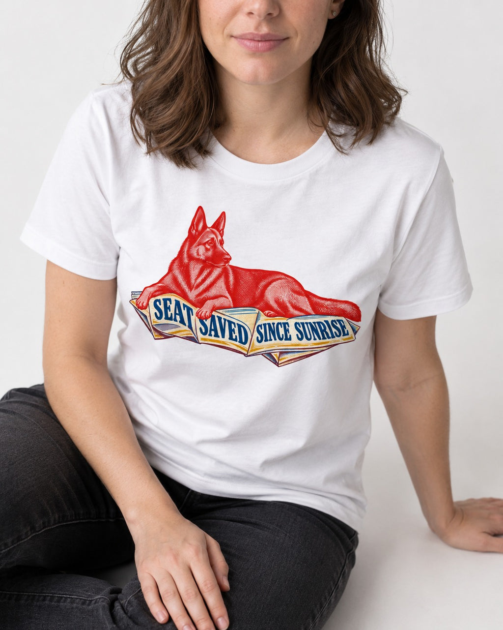 Seat Saved Since Sunrise German Shepherd Dog T-Shirt in White, worn by a seated model