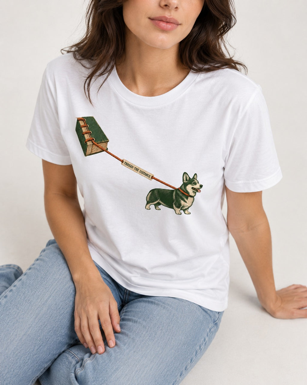Thread the Distance with Corgi T-Shirt in White, worn by a seated model