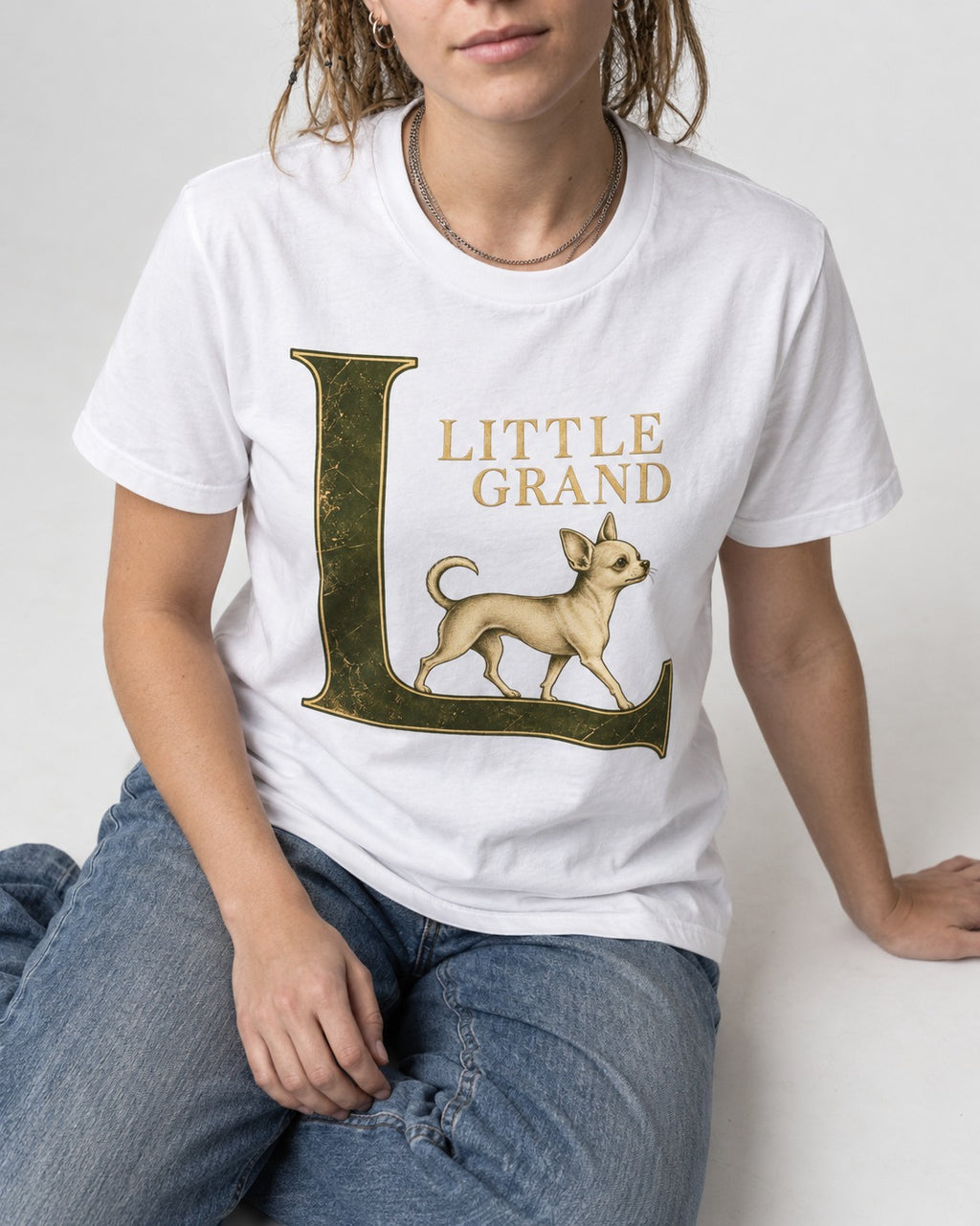 Little Grand Chihuahua T-Shirt in White, worn by a seated model