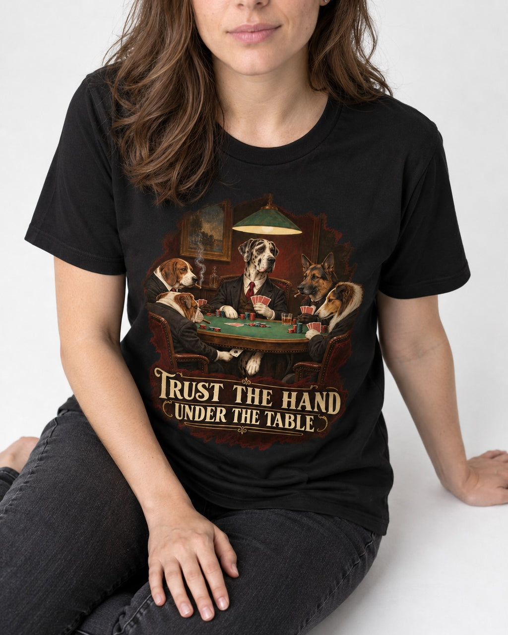 Great Dane Trust the Hand Under the Table Poker Graphic T-Shirt in Black, worn by a seated model