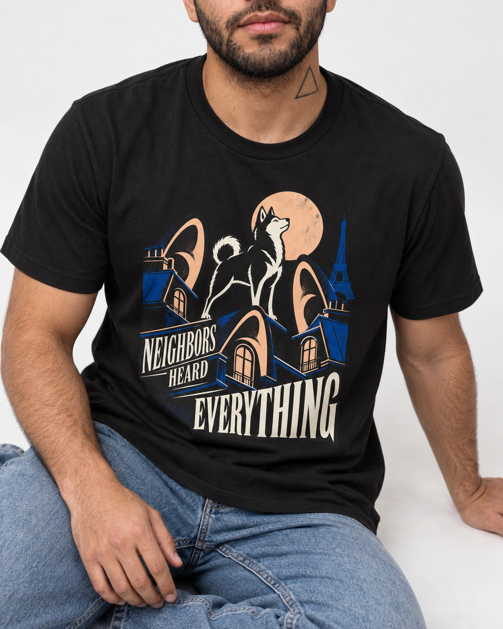 Husky Neighbors Heard Everything Paris Rooftop Graphic T-Shirt in Black, worn by a seated model